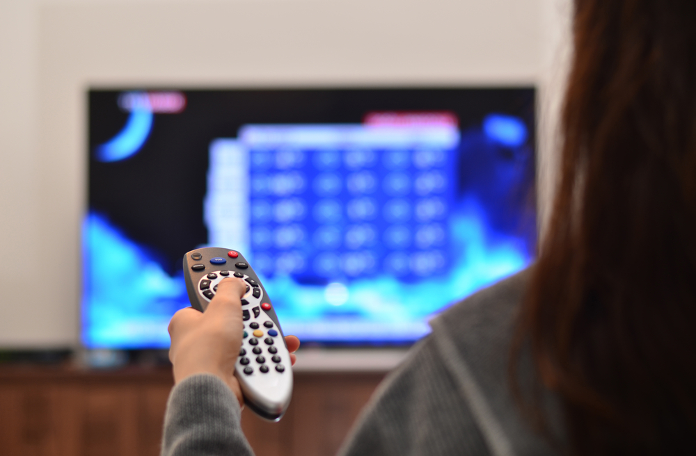 woman watching weather forecast